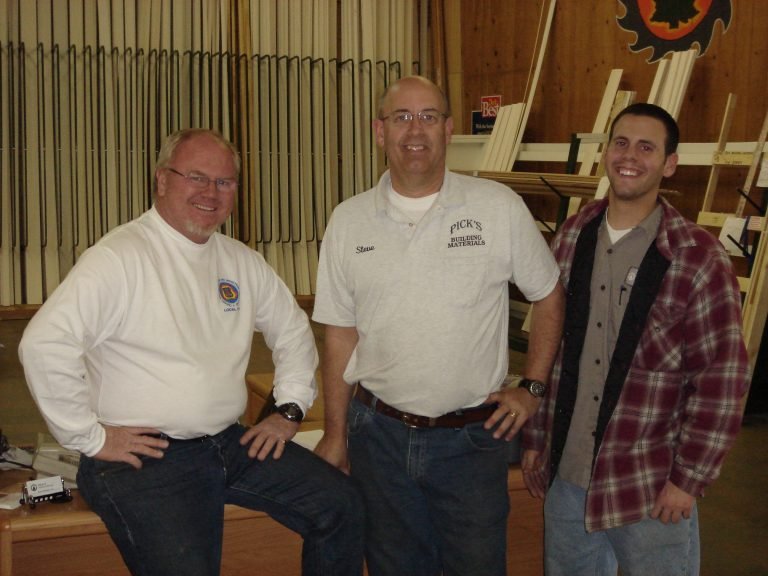 Steve Thurgood and the Pick's Lumber team at the yard